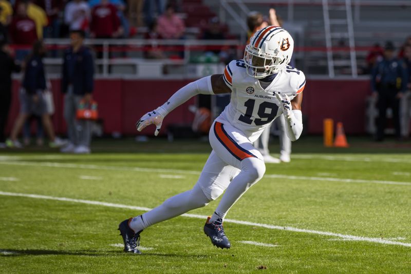 Nov 11, 2023; Fayetteville, Arkansas, USA;  Auburn Tigers safety Sylvester Smith (19) warms up before the game against the Arkansas Razorbacks at Donald W. Reynolds Razorback Stadium. Mandatory Credit: Brett Rojo-USA TODAY Sports