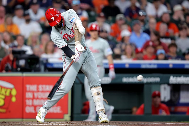 Jun 24, 2025; Houston, Texas, USA; Philadelphia Phillies right fielder Nick Castellanos (8) hits a single against the Houston Astros during the first inning at Daikin Park. Mandatory Credit: Erik Williams-Imagn Images