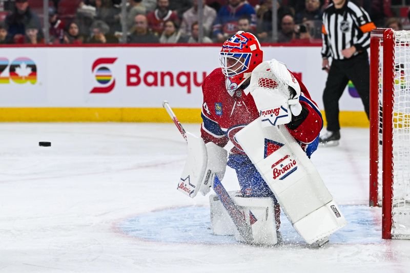 Jan 15, 2024; Montreal, Quebec, CAN; Montreal Canadiens goalie Jake Allen (34) tracks the puck against the Colorado Avalanche during the second period at Bell Centre. Mandatory Credit: David Kirouac-USA TODAY Sports