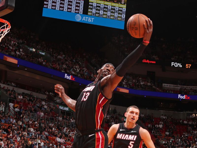 MIAMI, FL - MARCH 2: Bam Adebayo #13 of the Miami Heat rebounds during the game against the Utah Jazz on March 2, 2024 at Kaseya Center in Miami, Florida. NOTE TO USER: User expressly acknowledges and agrees that, by downloading and or using this Photograph, user is consenting to the terms and conditions of the Getty Images License Agreement. Mandatory Copyright Notice: Copyright 2024 NBAE (Photo by Issac Baldizon/NBAE via Getty Images)