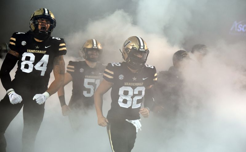 Nov 26, 2022; Nashville, Tennessee, USA; Vanderbilt Commodores tight end Justin Ball (84) and wide receiver Ezra McAllister (82) take the field before the game against the Tennessee Volunteers at FirstBank Stadium. Mandatory Credit: Christopher Hanewinckel-USA TODAY Sports