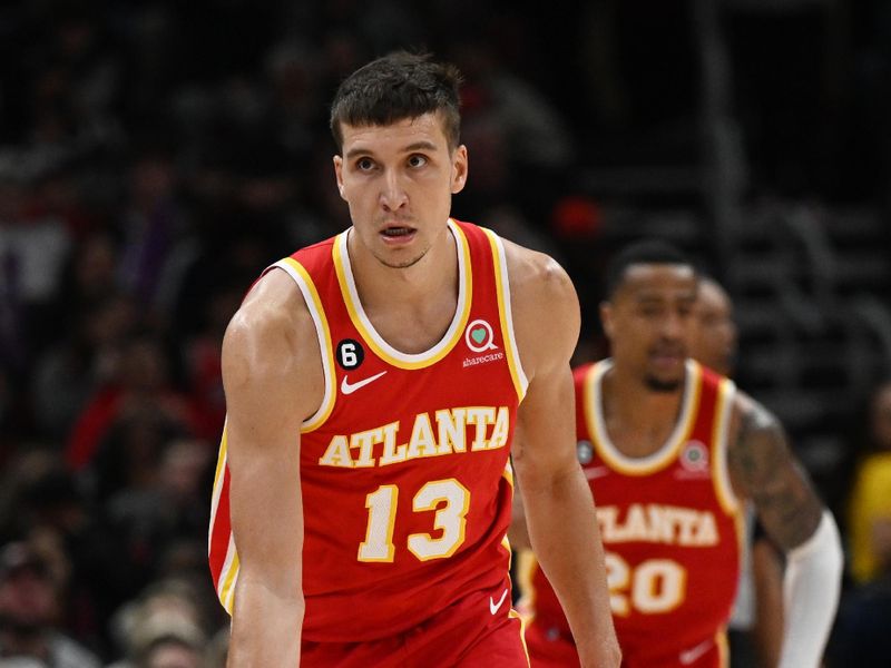 CHICAGO, ILLINOIS - APRIL 04: Bogdan Bogdanovic #13 of the Atlanta Hawks reacts in the second half after scoring against the Chicago Bulls at United Center on April 04, 2023 in Chicago, Illinois. NOTE TO USER: User expressly acknowledges and agrees that, by downloading and or using this photograph, User is consenting to the terms and conditions of the Getty Images License Agreement.  (Photo by Quinn Harris/Getty Images)