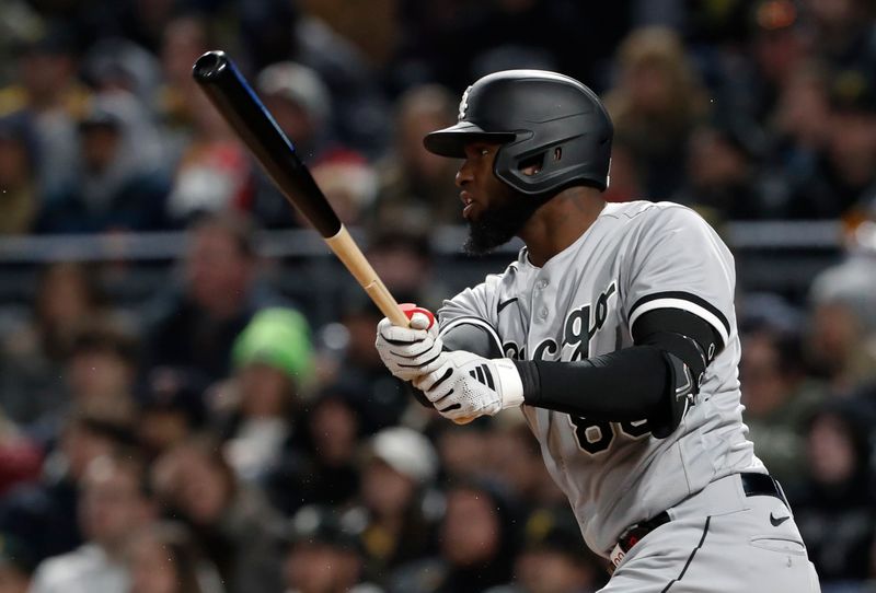 Apr 8, 2023; Pittsburgh, Pennsylvania, USA;  Chicago White Sox center fielder Luis Robert Jr. (88) hits a two-run single against the Pittsburgh Pirates during the seventh inning at PNC Park. Mandatory Credit: Charles LeClaire-USA TODAY Sports