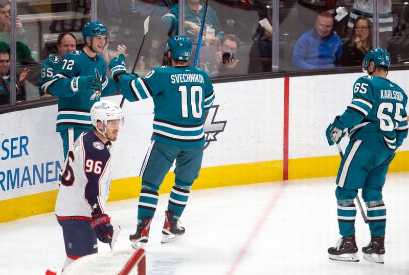 Mar 14, 2023; San Jose, California, USA; San Jose Sharks left winger William Eklund (72) is greeted by his teammates after scoring his first-ever NHL goal against the Columbus Blue Jackets during the second period at SAP Center at San Jose. Mandatory Credit: D. Ross Cameron-USA TODAY Sports