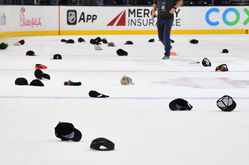 Nov 1, 2023; Anaheim, California, USA; Spectators throw hats celebrating the hat trick goal scored by Anaheim Ducks right wing Troy Terry (19) against the Arizona Coyotes at Honda Center. Mandatory Credit: Gary A. Vasquez-USA TODAY Sports