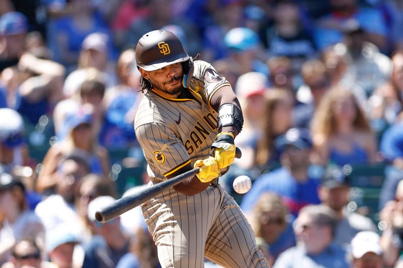 May 8, 2024; Chicago, Illinois, USA; San Diego Padres catcher Luis Campusano (12) singles against the Chicago Cubs during the fifth inning at Wrigley Field. Mandatory Credit: Kamil Krzaczynski-USA TODAY Sports