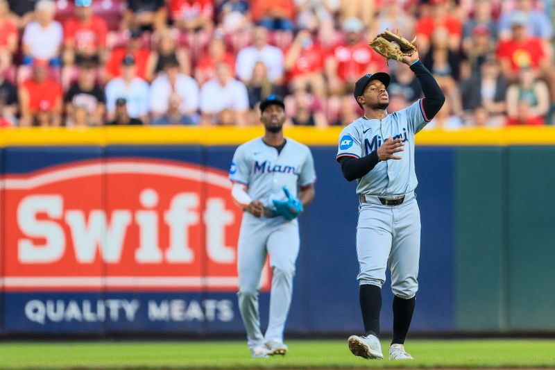 Jul 12, 2024; Cincinnati, Ohio, USA; Miami Marlins shortstop Xavier Edwards (63) catches a pop up hit by Cincinnati Reds shortstop Elly De La Cruz (not pictured) in the first inning at Great American Ball Park. Mandatory Credit: Katie Stratman-USA TODAY Sports