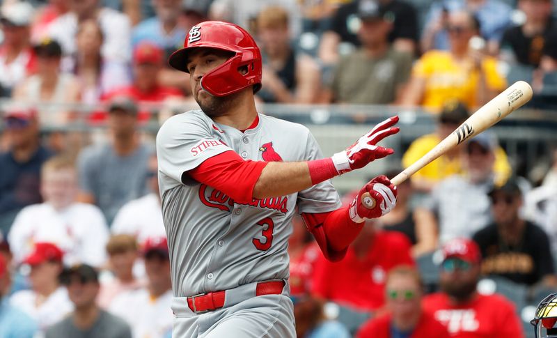 Jul 4, 2024; Pittsburgh, Pennsylvania, USA; St. Louis Cardinals center fielder Dylan Carlson (3) hits an RBI double against the Pittsburgh Pirates during the second inning at PNC Park. Mandatory Credit: Charles LeClaire-USA TODAY Sports