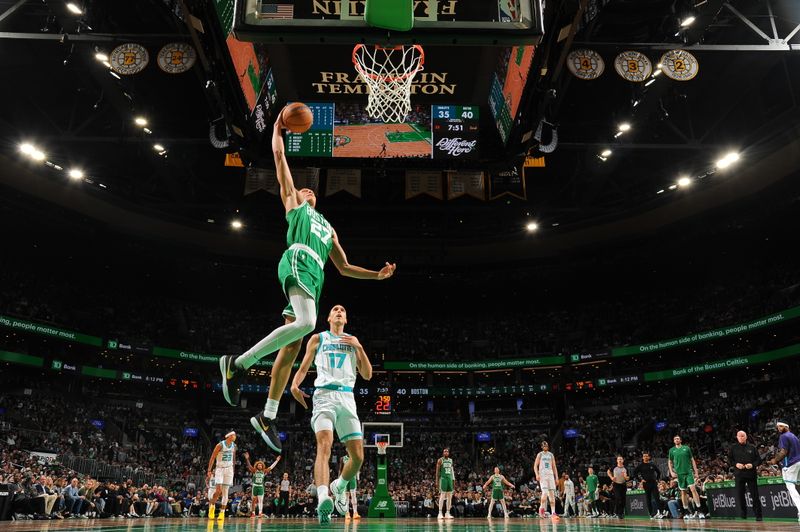 BOSTON, MA - APRIL 12: Jordan Walsh #27 of the Boston Celtics drives to the basket during the game against the Charlotte Hornets on April 12, 2024 at the TD Garden in Boston, Massachusetts. NOTE TO USER: User expressly acknowledges and agrees that, by downloading and or using this photograph, User is consenting to the terms and conditions of the Getty Images License Agreement. Mandatory Copyright Notice: Copyright 2024 NBAE  (Photo by Brian Babineau/NBAE via Getty Images)