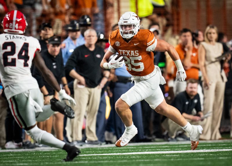 Oct 19, 2024; Austin, Texas, USA; Texas Longhorns tight end Gunnar Helm (85) carries the ball against the Georgia Bulldogs in the fourth quarter at Darrell K. Royal Texas Memorial Stadium. Mandatory Credit: Sara Diggins/USA TODAY Network via Imagn Images