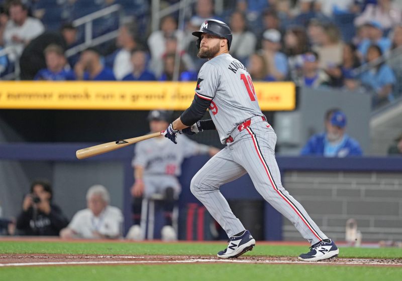 May 11, 2024; Toronto, Ontario, CAN; Minnesota Twins left fielder Alex Kirilloff (19) hits two run triple against the Toronto Blue Jays during the first inning at Rogers Centre. Mandatory Credit: Nick Turchiaro-USA TODAY Sports