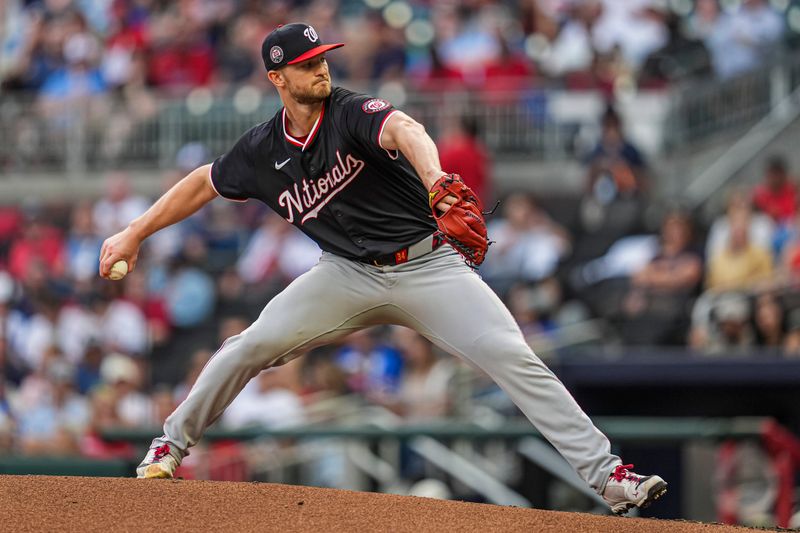 May 13, 2025; Cumberland, Georgia, USA; Washington Nationals starting pitcher Michael Soroka (34) pitches against the Atlanta Braves  during the second inning at Truist Park. Mandatory Credit: Dale Zanine-Imagn Images