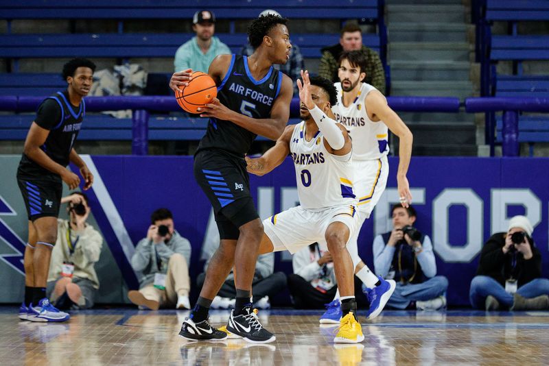 Jan 13, 2024; Colorado Springs, Colorado, USA; Air Force Falcons guard Ethan Taylor (5) controls the ball as San Jose State Spartans guard Myron Amey Jr. (0) guards in the first half at Clune Arena. Mandatory Credit: Isaiah J. Downing-USA TODAY Sports