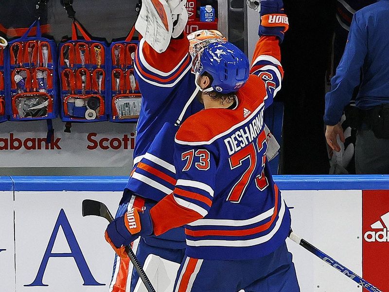 Jan 6, 2024; Edmonton, Alberta, CAN; Edmonton Oilers defensemen Vincent Desharnais (73) and goaltender Stuart Skinner (74) celebrate after defeating the Ottawa Senators at Rogers Place. Mandatory Credit: Perry Nelson-USA TODAY Sports