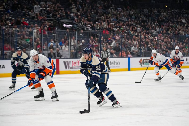 Oct 30, 2024; Columbus, Ohio, USA; Columbus Blue Jackets right wing Yegor Chinakhov (59) skates with the puck in the first period at Nationwide Arena. Mandatory Credit: Samantha Madar-Imagn Images