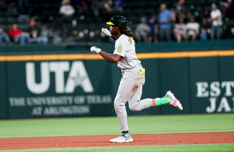 Apr 30, 2025; Arlington, Texas, USA;  Oakland Athletics right fielder Lawrence Butler (4) reacts after hitting a grand slam during the ninth inning against the Texas Rangers at Globe Life Field. Mandatory Credit: Kevin Jairaj-Imagn Images