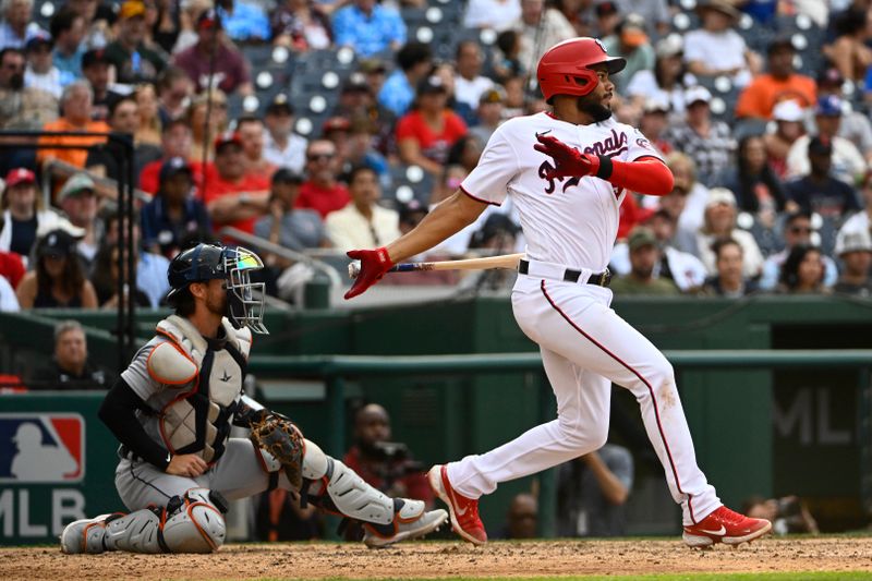 May 20, 2023; Washington, District of Columbia, USA; Washington Nationals third baseman Jeimer Candelario (9) hits an RBI double against the Detroit Tigers during the eighth inning at Nationals Park. Mandatory Credit: Brad Mills-USA TODAY Sports