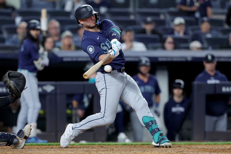 May 20, 2024; Bronx, New York, USA; Seattle Mariners first baseman Ty France (23) hits a go ahead RBI single against the New York Yankees during the ninth inning at Yankee Stadium. Mandatory Credit: Brad Penner-USA TODAY Sports