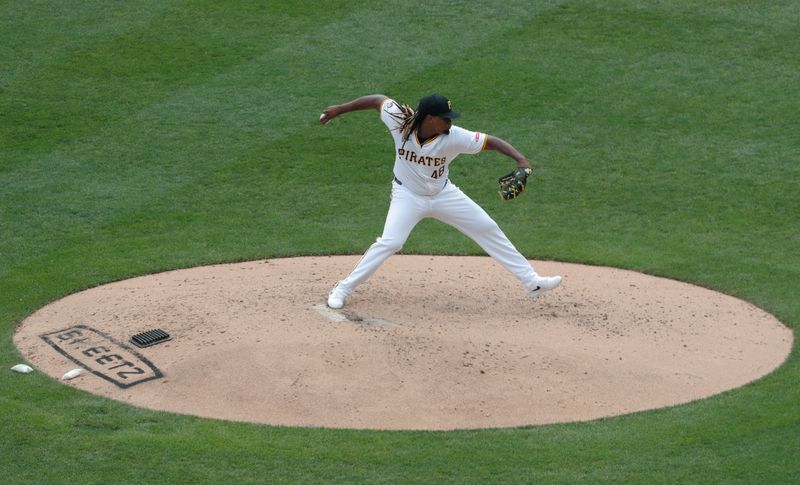 Aug 25, 2024; Pittsburgh, Pennsylvania, USA;  Pittsburgh Pirates starting pitcher Luis L. Ortiz (48) pitches against the Cincinnati Reds during the fourth inning at PNC Park. Mandatory Credit: Charles LeClaire-USA TODAY Sports