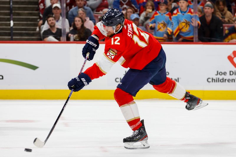 Feb 11, 2023; Sunrise, Florida, USA; Florida Panthers center Eric Staal (12) shoots the puck during the second period against the Colorado Avalanche at FLA Live Arena. Mandatory Credit: Sam Navarro-USA TODAY Sports