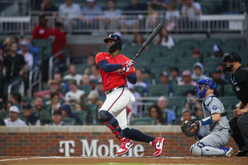 Sep 13, 2024; Atlanta, Georgia, USA; Atlanta Braves right fielder Jorge Soler (2) hits a single against the Los Angeles Dodgers in the first inning at Truist Park. Mandatory Credit: Brett Davis-Imagn Images
