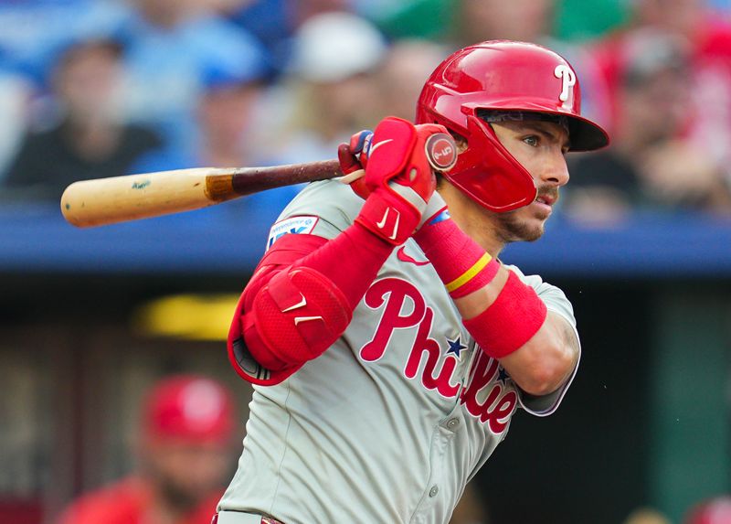 Aug 24, 2024; Kansas City, Missouri, USA; Philadelphia Phillies second baseman Bryson Stott (5) hits a single during the fourth inning against the Kansas City Royals at Kauffman Stadium. Mandatory Credit: Jay Biggerstaff-USA TODAY Sports