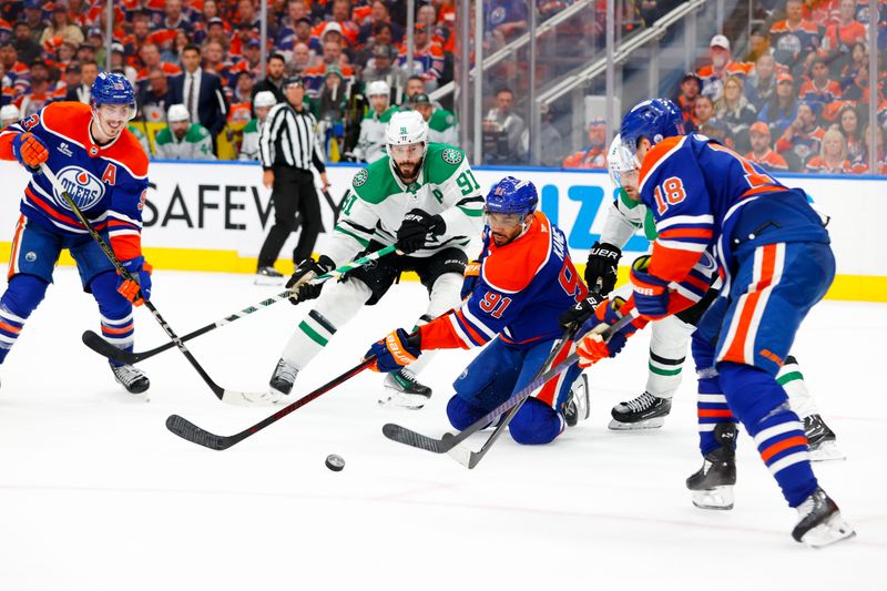 May 25, 2025; Edmonton, Alberta, CAN; Edmonton Oilers center Ryan Nugent-Hopkins (93) and left wing Evander Kane (91) and left wing Zach Hyman (18) and Dallas Stars center Tyler Seguin (91) look for the puck during the third period in game three of the Western Conference Final of the 2025 Stanley Cup Playoffs at Rogers Place. Mandatory Credit: Perry Nelson-Imagn Images