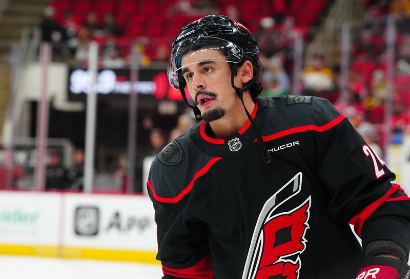 Oct 31, 2024; Raleigh, North Carolina, USA;  Carolina Hurricanes center Seth Jarvis (24) skates before the game during the warmups against the Boston Bruins at Lenovo Center. Mandatory Credit: James Guillory-Imagn Images