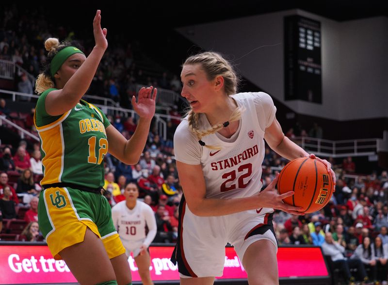 Jan 29, 2023; Stanford, California, USA; Stanford Cardinal forward Cameron Brink (22) controls the ball against Oregon Ducks guard Te-Hina Paopao (12) during the third quarter at Maples Pavilion. Mandatory Credit: Kelley L Cox-USA TODAY Sports