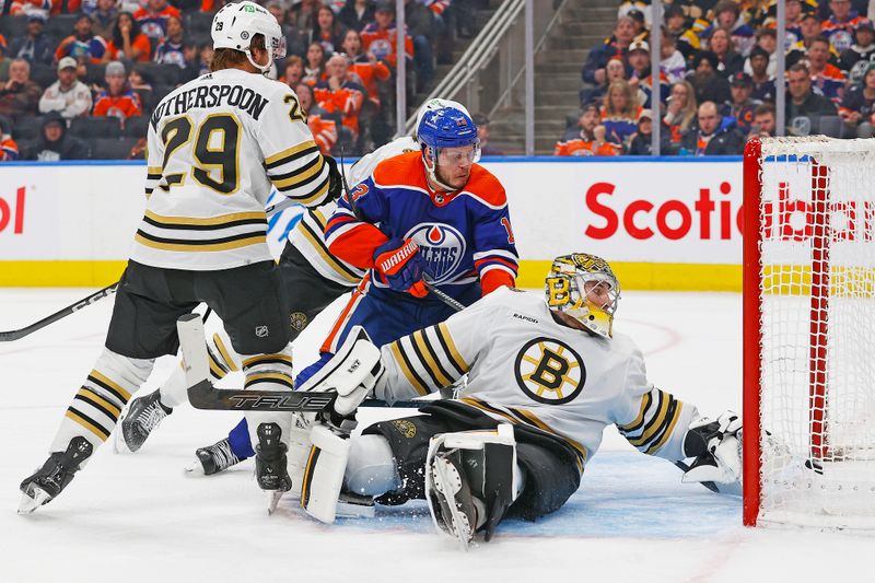 Feb 21, 2024; Edmonton, Alberta, CAN; Edmonton Oilers forward Mattias Janmark (13) scores a goal during the third period against Boston Bruins goaltender Jeremy Swayman (1)  at Rogers Place. Mandatory Credit: Perry Nelson-USA TODAY Sports