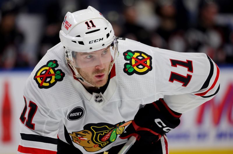 Jan 18, 2024; Buffalo, New York, USA;  Chicago Blackhawks right wing Taylor Raddysh (11) waits for the face-off during the third period against the Buffalo Sabres at KeyBank Center. Mandatory Credit: Timothy T. Ludwig-USA TODAY Sports