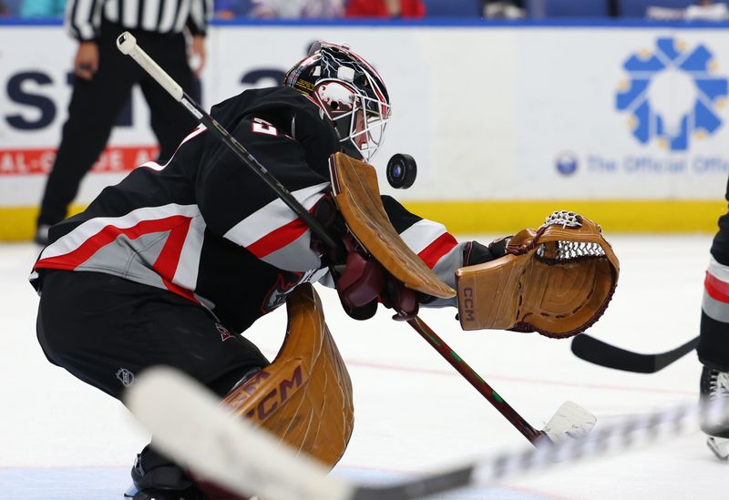 Nov 1, 2024; Buffalo, New York, USA;  Buffalo Sabres goaltender Devon Levi (27) looks to make a save during the third period against the New York Islanders at KeyBank Center. Mandatory Credit: Timothy T. Ludwig-Imagn Images