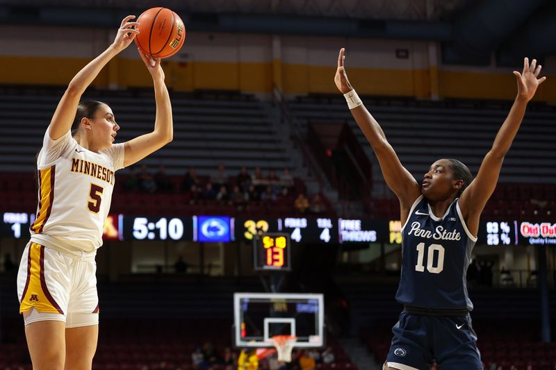 Jan 31, 2024; Minneapolis, Minnesota, USA; Minnesota Golden Gophers guard Maggie Czinano (5) shoots as Penn State Nittany Lions forward Chanaya Pinto (10) defends during the first half at Williams Arena. Mandatory Credit: Matt Krohn-USA TODAY Sports