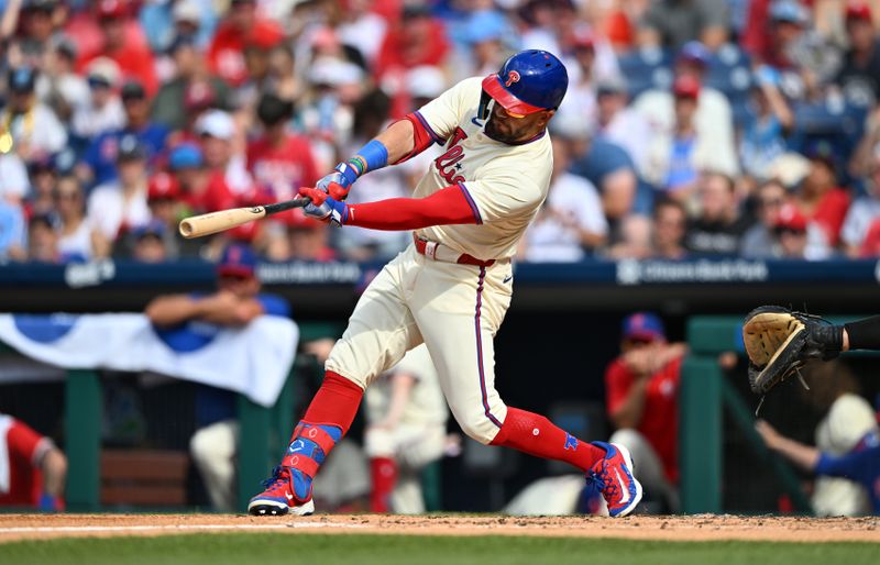Jul 13, 2024; Philadelphia, Pennsylvania, USA; Philadelphia Phillies designated hitter Kyle Schwarber (12) hits an RBI double against the Oakland Athletics in the third inning at Citizens Bank Park. Mandatory Credit: Kyle Ross-USA TODAY Sports