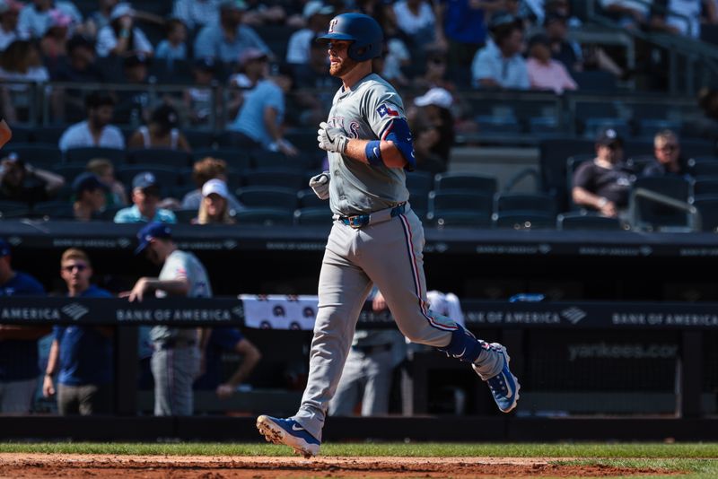 Aug 11, 2024; Bronx, New York, USA; Texas Rangers catcher Carson Kelly (18) rounds the bases after hitting a two run home run during the eighth inning against the New York Yankees at Yankee Stadium. Mandatory Credit: Vincent Carchietta-USA TODAY Sports