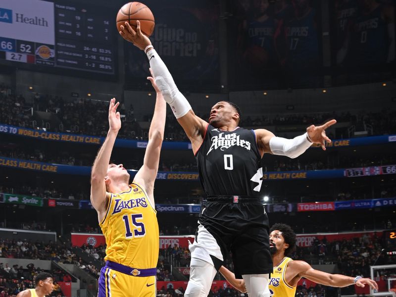 LOS ANGELES, CA - FEBRUARY 28: Russell Westbrook #0 of the LA Clippers drives to the basket during the game against the Los Angeles Lakers on February 28, 2024 at Crypto.Com Arena in Los Angeles, California. NOTE TO USER: User expressly acknowledges and agrees that, by downloading and/or using this Photograph, user is consenting to the terms and conditions of the Getty Images License Agreement. Mandatory Copyright Notice: Copyright 2024 NBAE (Photo by Andrew D. Bernstein/NBAE via Getty Images)