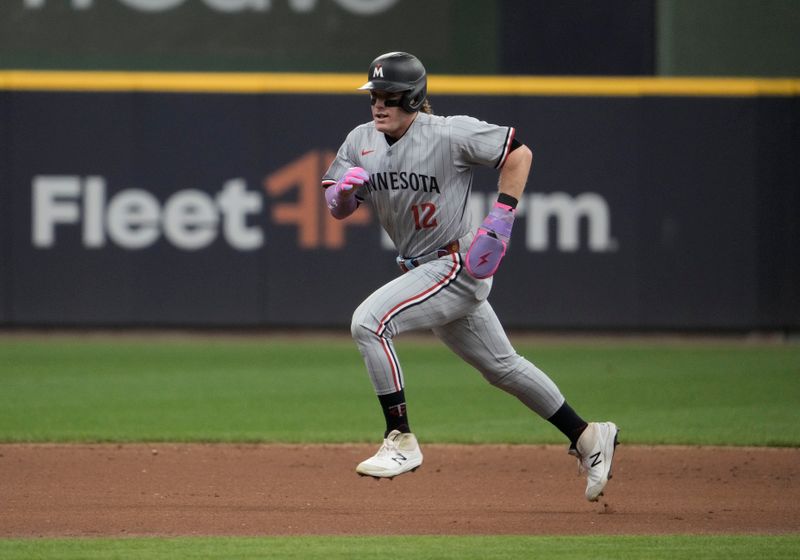 May 18, 2025; Milwaukee, Wisconsin, USA; Minnesota Twins outfielder Harrison Bader (12) runs to third base against the Milwaukee Brewers in the second inning at American Family Field. Mandatory Credit: Michael McLoone-Imagn Images