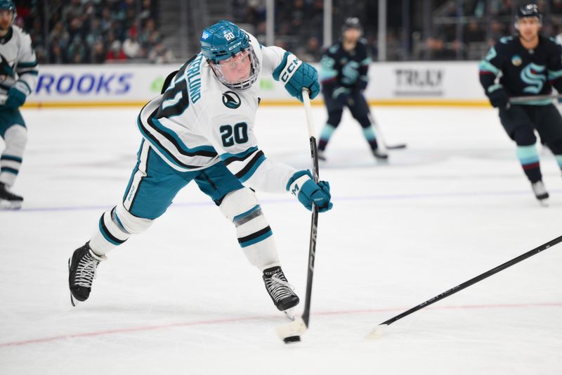 Nov 30, 2024; Seattle, Washington, USA; San Jose Sharks left wing Fabian Zetterlund (20) shoots the puck against the Seattle Kraken during the first period at Climate Pledge Arena. Mandatory Credit: Steven Bisig-Imagn Images