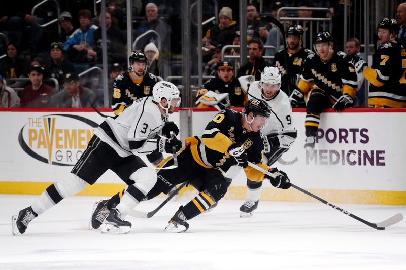 Feb 18, 2024; Pittsburgh, Pennsylvania, USA;  Pittsburgh Penguins left wing Drew O'Connor (10) moves the puck against Los Angeles Kings defenseman Matt Roy (3) and right wing Adrian Kempe (9) during the third period at PPG Paints Arena. Los Angeles won 2-1. Mandatory Credit: Charles LeClaire-USA TODAY Sports