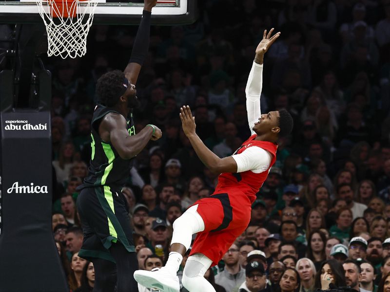 BOSTON, MA - NOVEMBER 16: RJ Barrett #9 of the Toronto Raptors throws up a shot against Neemias Queta #88 of the Boston Celtics during the second quarter at TD Garden on November 16, 2024 in Boston, Massachusetts. NOTE TO USER: User expressly acknowledges and agrees that, by downloading and/or using this Photograph, user is consenting to the terms and conditions of the Getty Images License Agreement. (Photo By Winslow Townson/Getty Images)