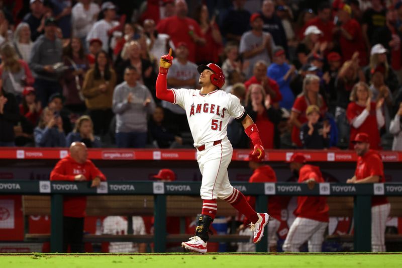 Sep 28, 2024; Anaheim, California, USA;  Los Angeles Angels right fielder Gustavo Campero (51) reacts after hitting a home run during the third inning against the Texas Rangers at Angel Stadium. Mandatory Credit: Kiyoshi Mio-Imagn Images