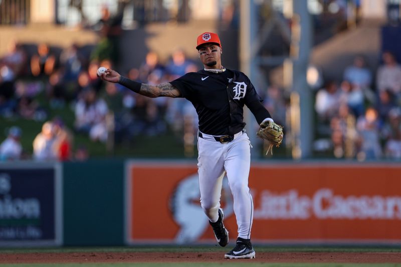 Mar 19, 2024; Lakeland, Florida, USA;  Detroit Tigers shortstop Javier Baez (28) throws to first fro an out against the Philadelphia Phillies in the sixth inning at Publix Field at Joker Marchant Stadium. Mandatory Credit: Nathan Ray Seebeck-USA TODAY Sports