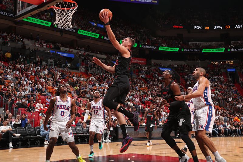 MIAMI, FL - APRIL 4: Nikola Jovic #5 of the Miami Heat drives to the basket during the game against the Philadelphia 76ers on April 4, 2024 at Kaseya Center in Miami, Florida. NOTE TO USER: User expressly acknowledges and agrees that, by downloading and or using this Photograph, user is consenting to the terms and conditions of the Getty Images License Agreement. Mandatory Copyright Notice: Copyright 2024 NBAE (Photo by Issac Baldizon/NBAE via Getty Images)