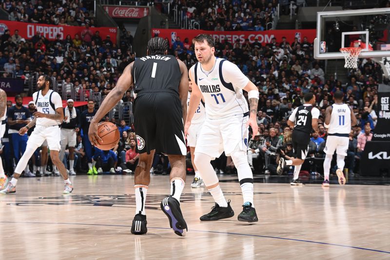 LOS ANGELES, CA - APRIL 23: Luka Doncic #77 of the Dallas Mavericks plays defense against the LA Clippers during Round 1 Game 2 of the 2024 NBA Playoffs on April 23, 2024 at Crypto.Com Arena in Los Angeles, California. NOTE TO USER: User expressly acknowledges and agrees that, by downloading and/or using this Photograph, user is consenting to the terms and conditions of the Getty Images License Agreement. Mandatory Copyright Notice: Copyright 2024 NBAE (Photo by Andrew D. Bernstein/NBAE via Getty Images)