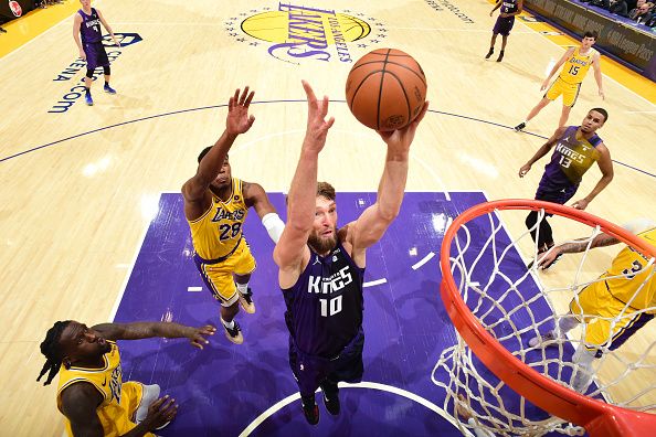 LOS ANGELES, CA - NOVEMBER 15: Domantas Sabonis #10 of the Sacramento Kings rebounds the ball during the game against the Los Angeles Lakers on November 15, 2023 at Crypto.Com Arena in Los Angeles, California. NOTE TO USER: User expressly acknowledges and agrees that, by downloading and/or using this Photograph, user is consenting to the terms and conditions of the Getty Images License Agreement. Mandatory Copyright Notice: Copyright 2023 NBAE (Photo by Adam Pantozzi/NBAE via Getty Images)