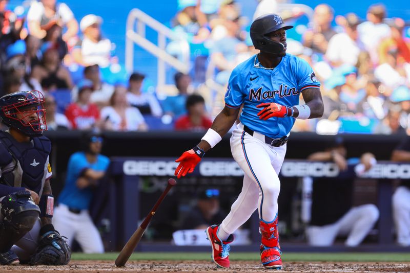 Apr 14, 2024; Miami, Florida, USA; Miami Marlins center fielder Jazz Chisholm Jr. (2) hits an RBI double against the Atlanta Braves during the fourth inning at loanDepot Park. Mandatory Credit: Sam Navarro-USA TODAY Sports