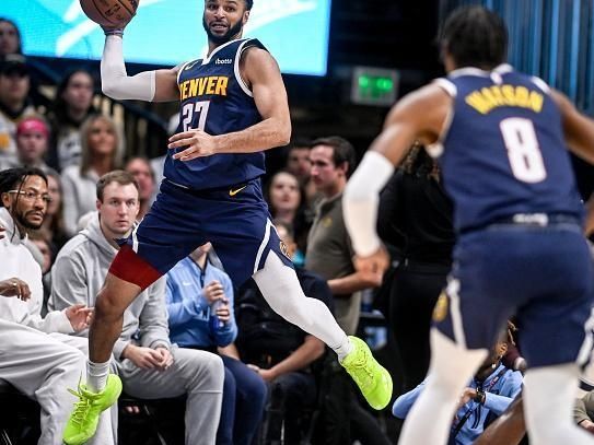 DENVER, CO - DECEMBER 28: Jamal Murray (27) of the Denver Nuggets saves a loose ball before passing to Peyton Watson (8) during the first quarter against the Memphis Grizzlies at Ball Arena in Denver on Thursday, December 28, 2023. (Photo by AAron Ontiveroz/The Denver Post)