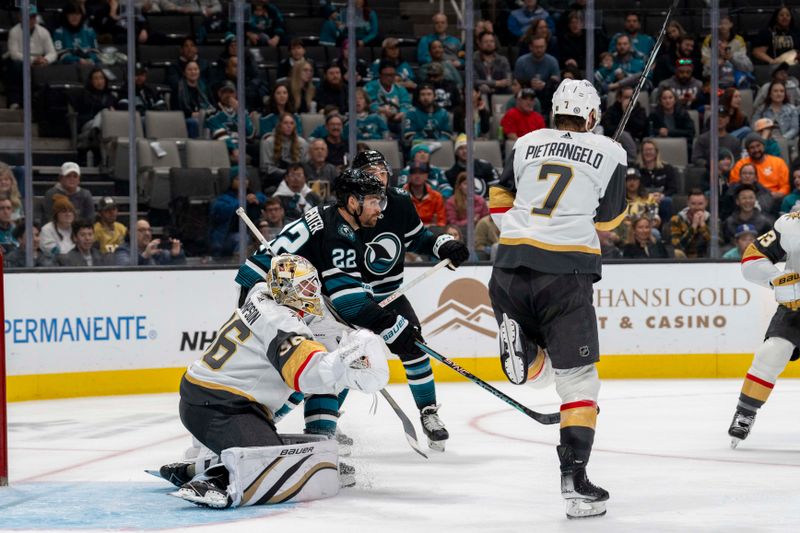 Feb 19, 2024; San Jose, California, USA; Vegas Golden Knights defenseman Alex Pietrangelo (7) deflects the shot on goal in front of San Jose Sharks center Ryan Carpenter (22) during the second period at SAP Center at San Jose. Mandatory Credit: Neville E. Guard-USA TODAY Sports