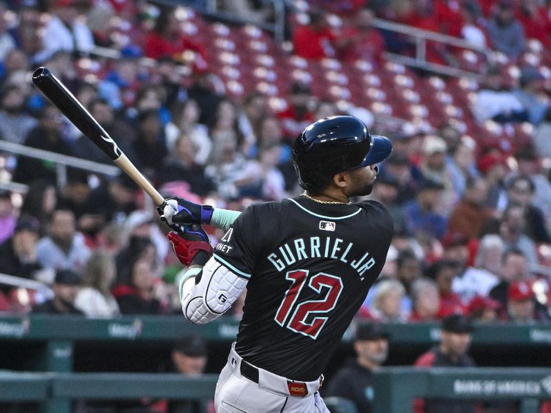 Apr 23, 2024; St. Louis, Missouri, USA;  Arizona Diamondbacks left fielder Lourdes Gurriel Jr. (12) hits a one runs single against the St. Louis Cardinals during the third inning at Busch Stadium. Mandatory Credit: Jeff Curry-USA TODAY Sports