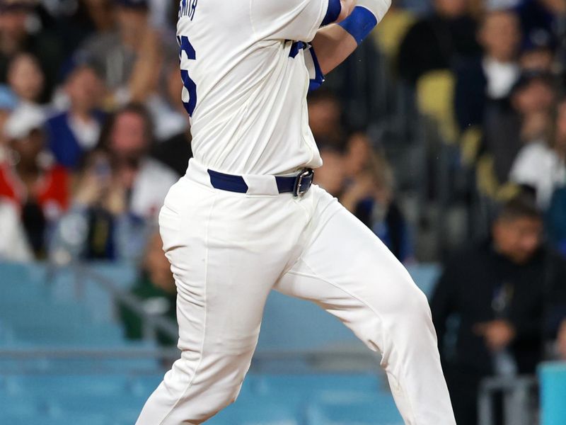 May 17, 2024; Los Angeles, California, USA;  Los Angeles Dodgers catcher Will Smith (16) hits an RBI single during the seventh inning against the Cincinnati Reds at Dodger Stadium. Mandatory Credit: Kiyoshi Mio-USA TODAY Sports